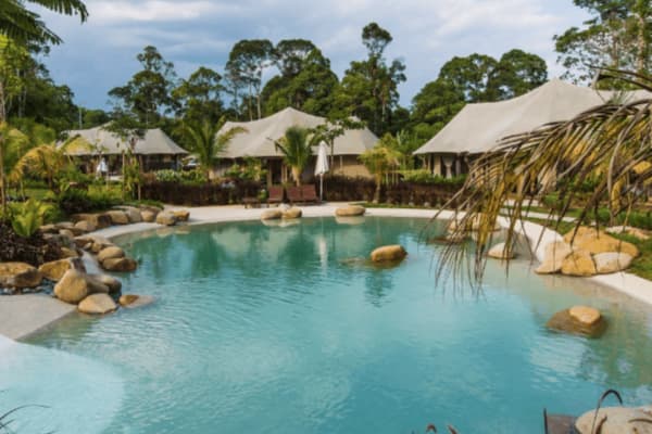 Tiarasa Escapes natural lagoon pool rainforest boulders safari tents